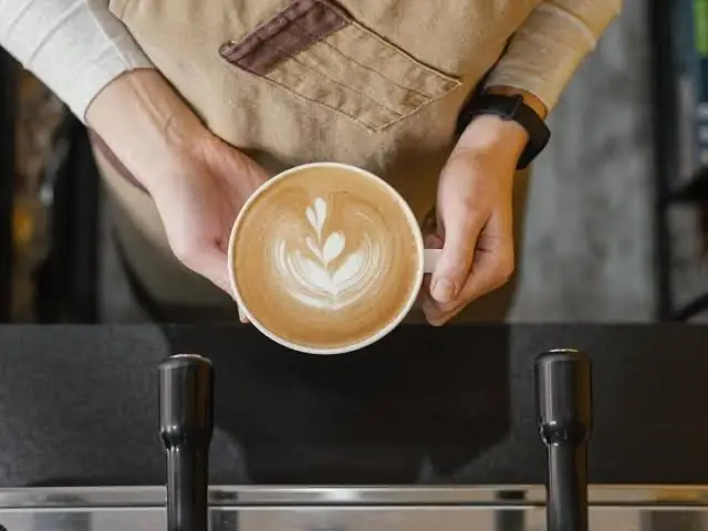 Barista pouring latte art